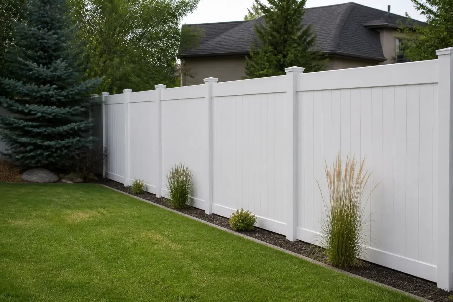 Fresh vinyl fence line in a Boise backyard