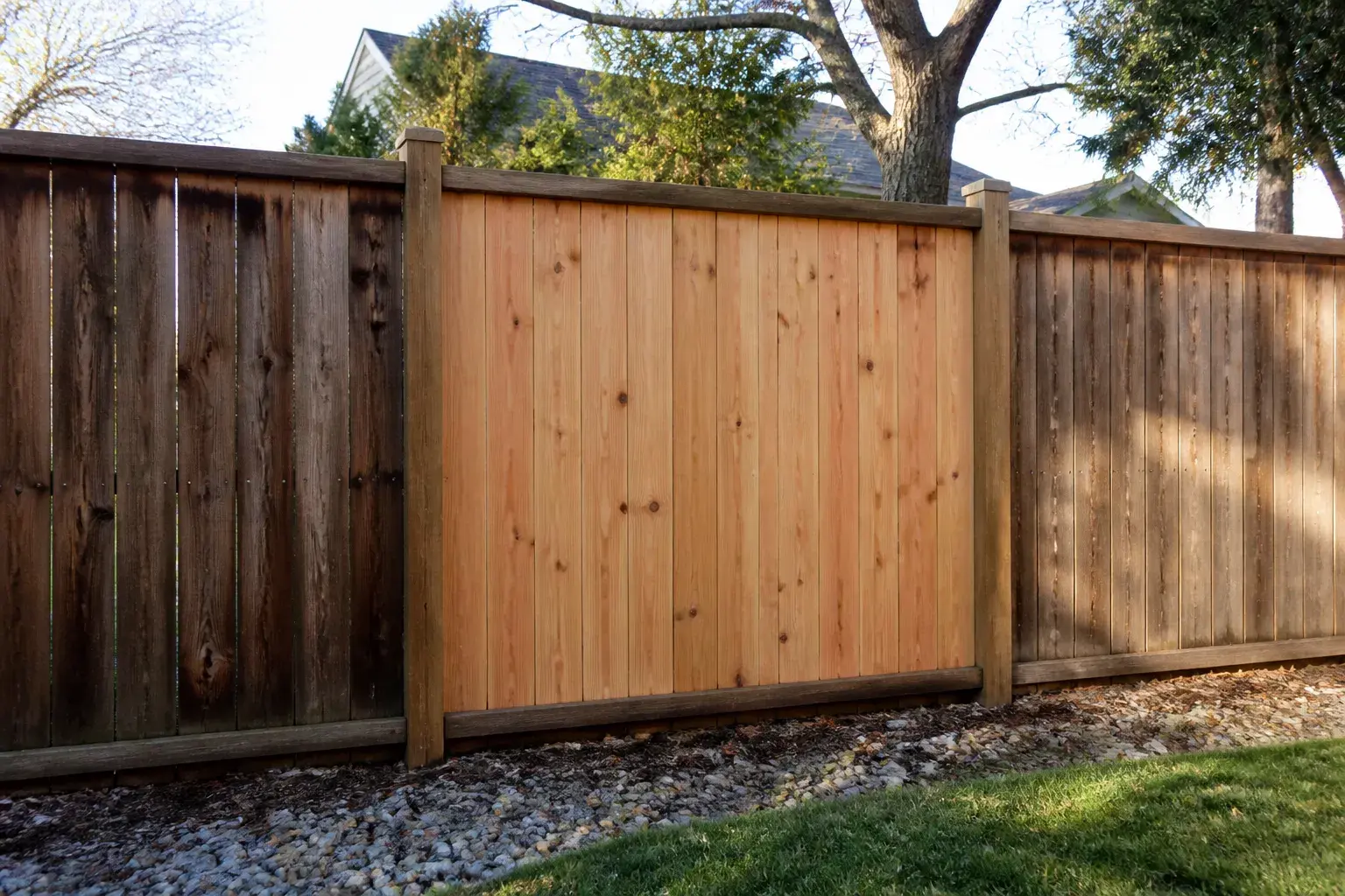 Repaired fence section aligned with the original fence